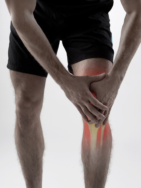 Knee pain on gray - Photo, Image
