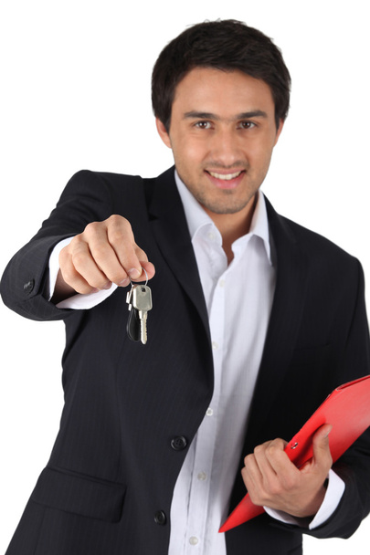 Estate agent offering house keys - Fotó, kép