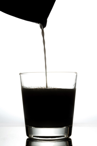 milk from box into a glass - Фото, изображение