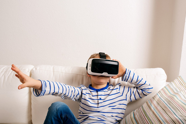 Boy wearing virtual reality goggles - Photo, image
