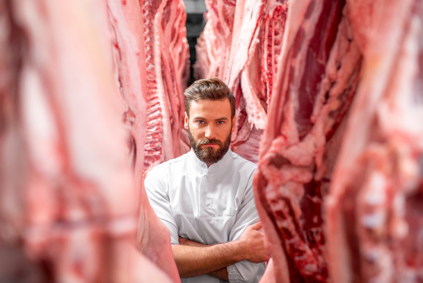 Butcher at the meat manufacturing - Foto, Bild