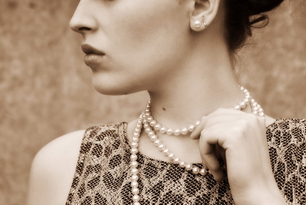 Beautiful girl with a white beads - Zdjęcie, obraz