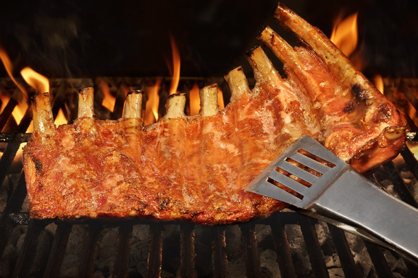 Pork Baby Back Or Spareribs On BBQ Grill With Flames - Photo, Image