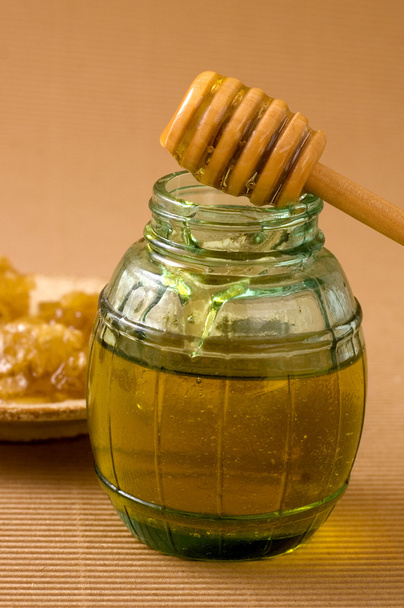Pentes de mel e pau de mel de madeira
 - Foto, Imagem