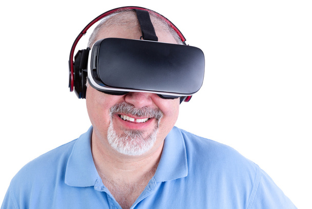 Mature man smiling with virtual reality headset - Zdjęcie, obraz