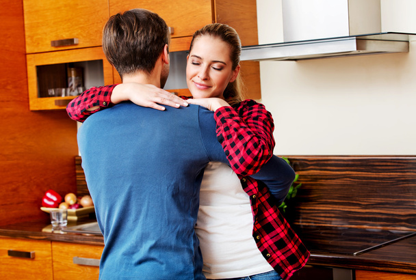 Young couple dancing and having fun in the kitchen - 写真・画像