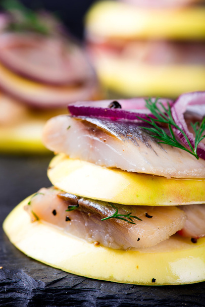 Appetizer canape with herring, apples  - Foto, afbeelding