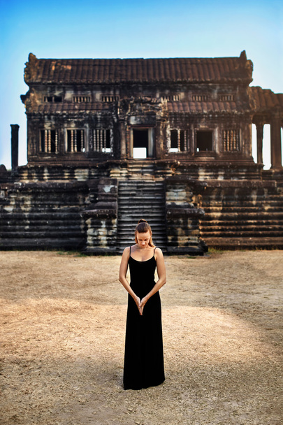 Meditation. Woman Meditating At Angkor Wat Temple, Cambodia. Bud - 写真・画像