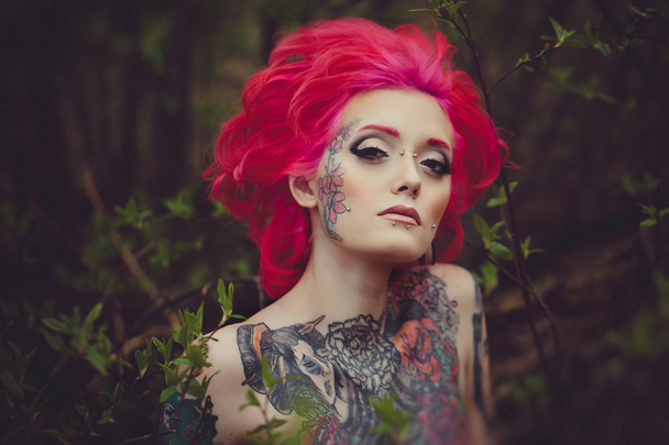 Portrait of tattooed girl with pink hair - Foto, Imagem