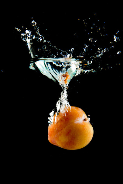 Plum falling in the water - Photo, image