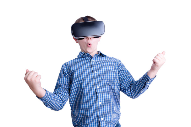 Excited boy looking with virtual reality headset - 写真・画像