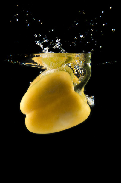 yellow pepper falling - Фото, изображение