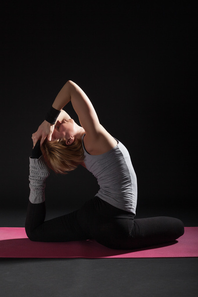 Woman practicing yoga - Fotó, kép