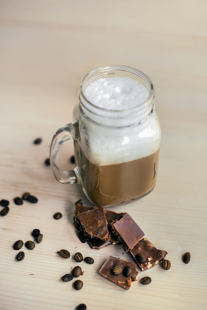 Cappuccino in a glass jar. The view from the top. - Foto, Imagen