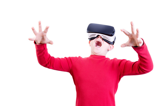 Amazed young child in virtual reality headset - Foto, imagen