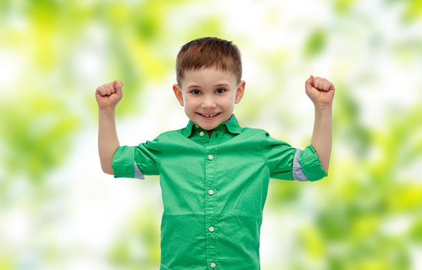 happy smiling little boy with raised hand - Фото, зображення