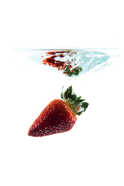 strawberry falling in the water - 写真・画像