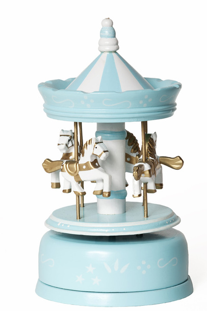blauwe merry-go-round speelgoed op wit - Foto, afbeelding