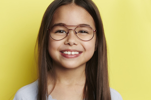 Young girl in glasses smiling - Photo, Image