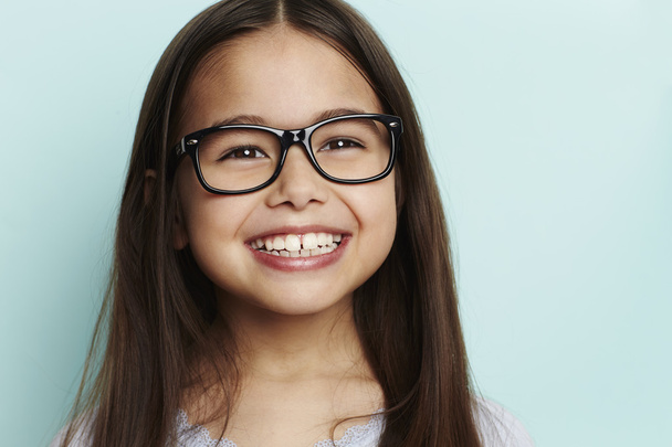 Spectacles on smiley girl - 写真・画像