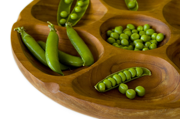Fresh green peas in wooden bowl - Photo, Image
