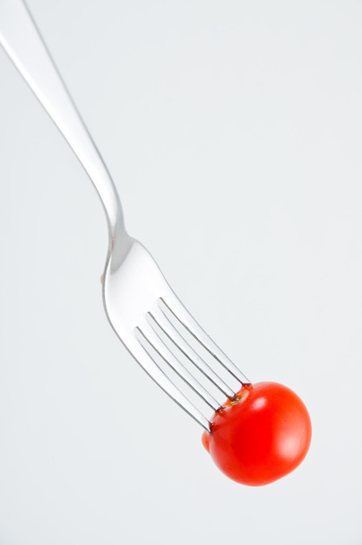 Cherry tomato on a fork - Zdjęcie, obraz