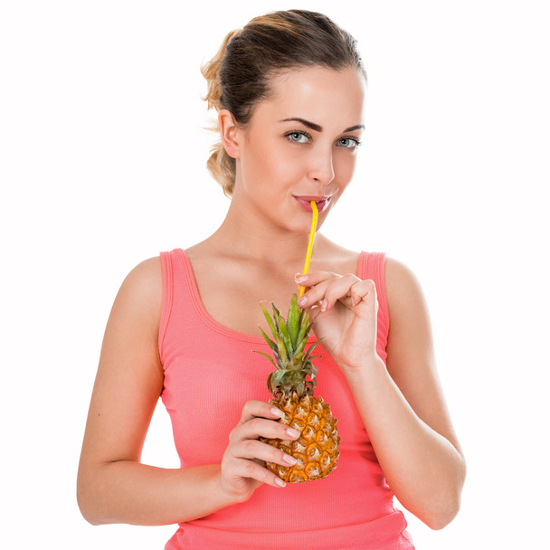 Portrait of a beautiful young woman with  with pineapple - Photo, Image