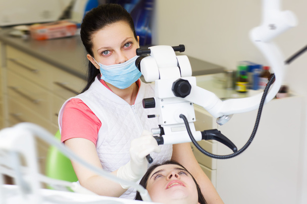 professional dentist examination patient with microscope - Zdjęcie, obraz