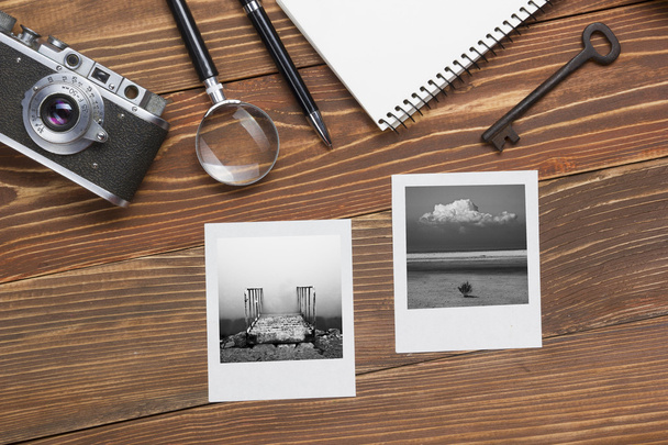 Travel, vacation concept. Camera, notepad, pen, credit card, supplies and photography on office wooden desk table. Top view with copy space for text - Fotoğraf, Görsel