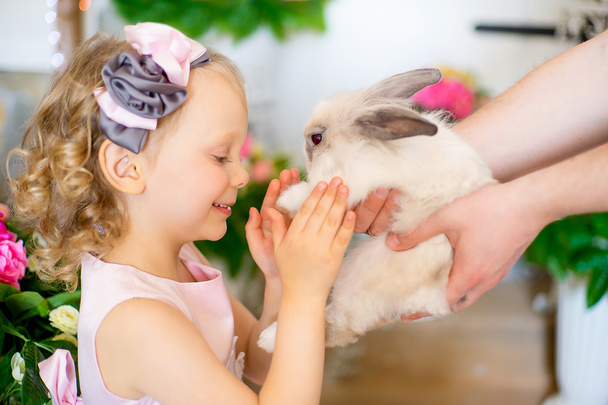 little girl with a rabbit - Фото, зображення