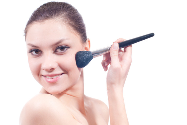Young woman with makeup brushes - Fotó, kép