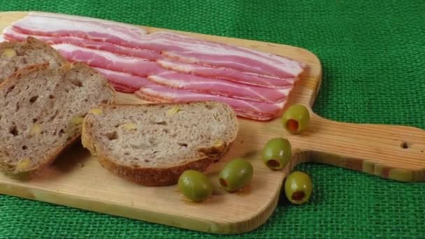 Cutting board with bacon and bread - Footage, Video
