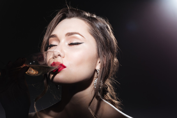 Charming woman drinking champagne - Foto, Imagem
