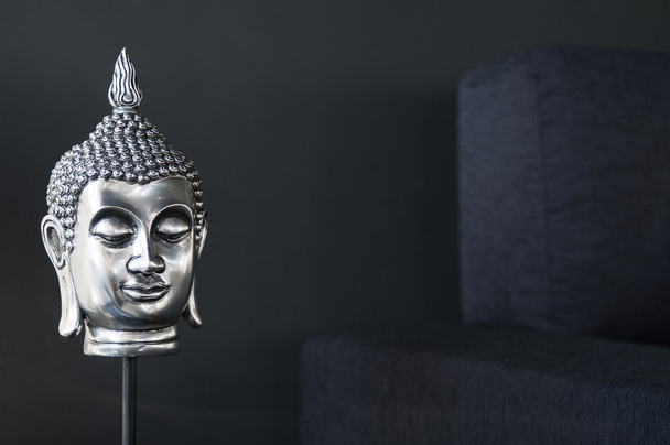 Contemporary interior design detail with buddha image and sofa - Foto, Bild