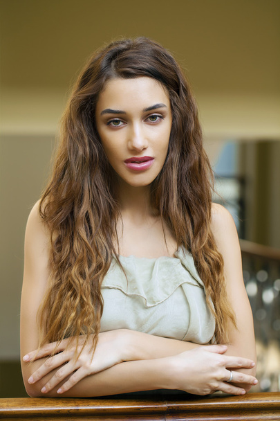 Portrait close up of young beautiful brunette woman in beige dre - Foto, Bild