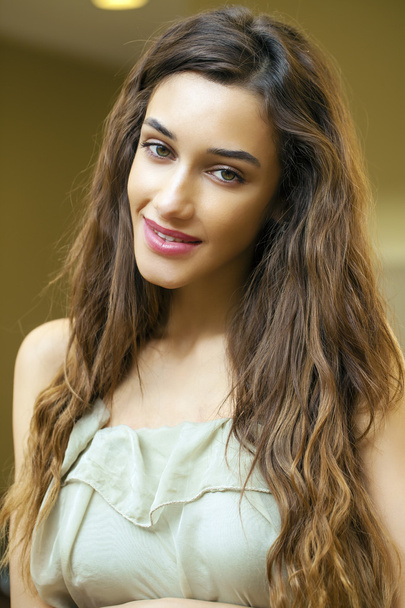Portrait close up of young beautiful brunette woman in beige dre - Photo, Image