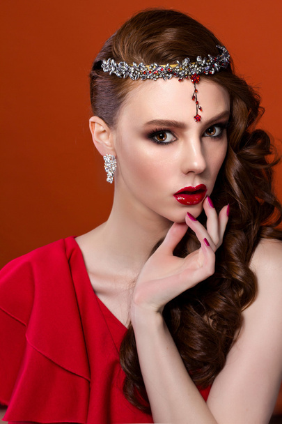Beauty woman in red dress, red background. Red lips and nails. - 写真・画像