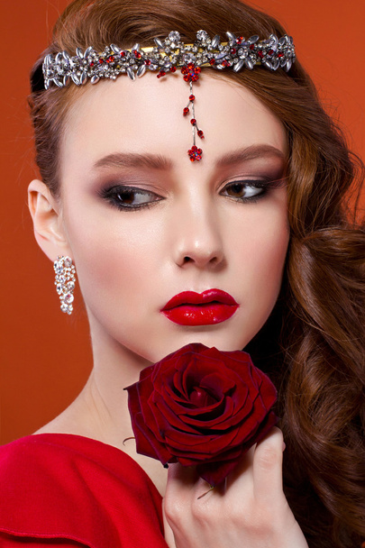 Beauty woman with red rose. Fashion girl face portrait with red  - Photo, image