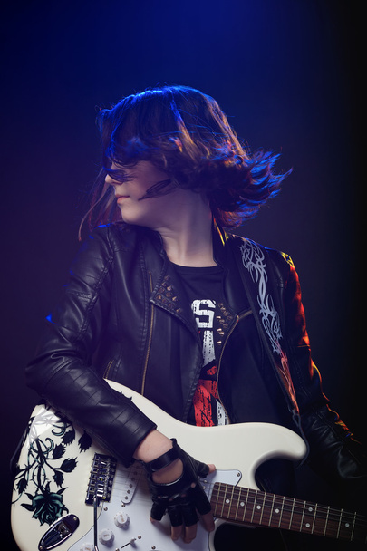 Young attractive rock girl playing the electric guitar  - Photo, Image