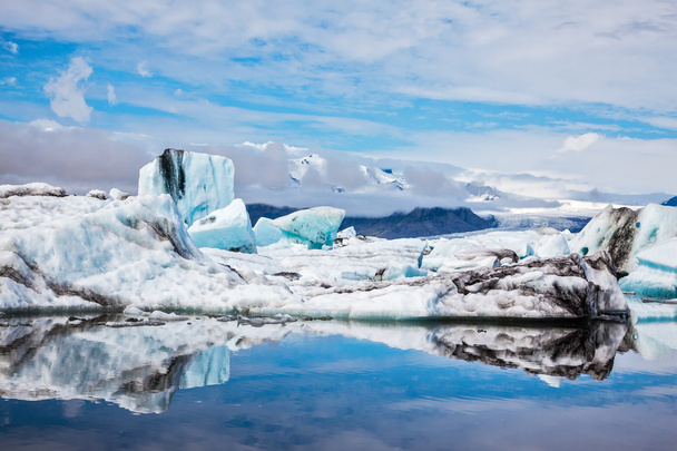 Ice floes reflected in water of ocean - Φωτογραφία, εικόνα