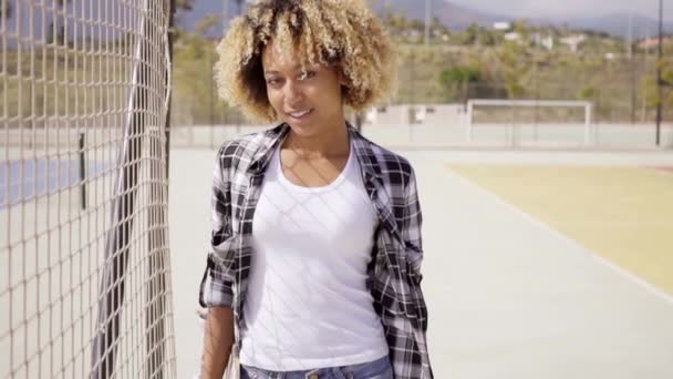 woman walking with skateboard in hands - Footage, Video