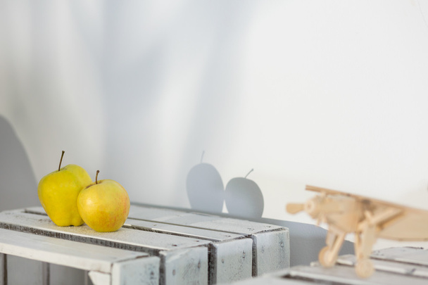 Shadows of two apples on wall - Fotografie, Obrázek