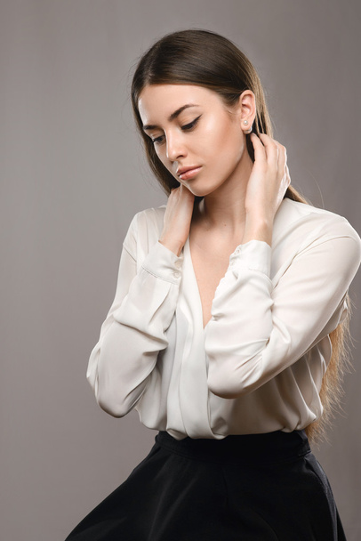 Portrait beautiful girl in white blouse and black skirt - Fotografie, Obrázek