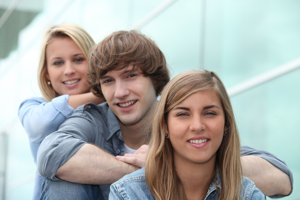 Three students sitting on stairs - Foto, Imagen