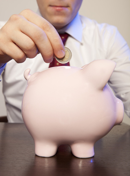 Businessman with pink piggy bank - Photo, Image