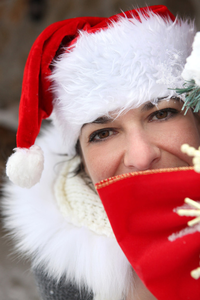 Woman with Christmas cap - Photo, Image