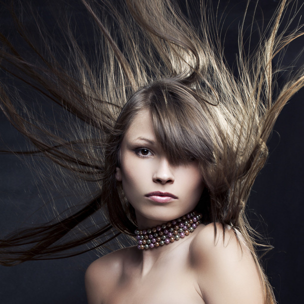 Portrait of a beautiful woman with long straight hair - Photo, Image