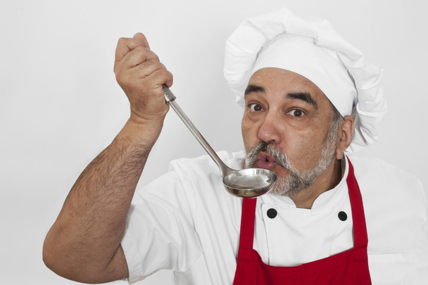 aantrekkelijke chef-kok met pollepel - Foto, afbeelding