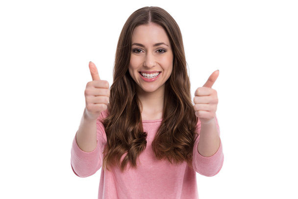 Young woman with thumbs up - Fotó, kép