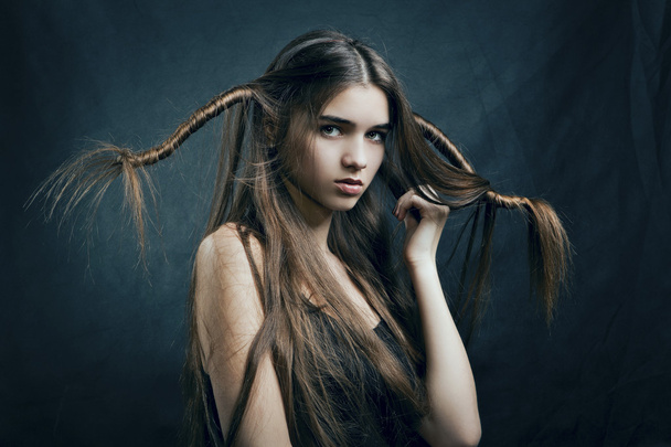 Portrait of a beautiful woman with perfect hair - Фото, зображення